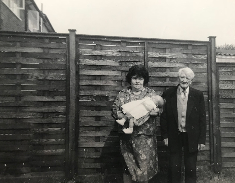 My great grandma and great grandad with my mum in their garden in Roundtable Road